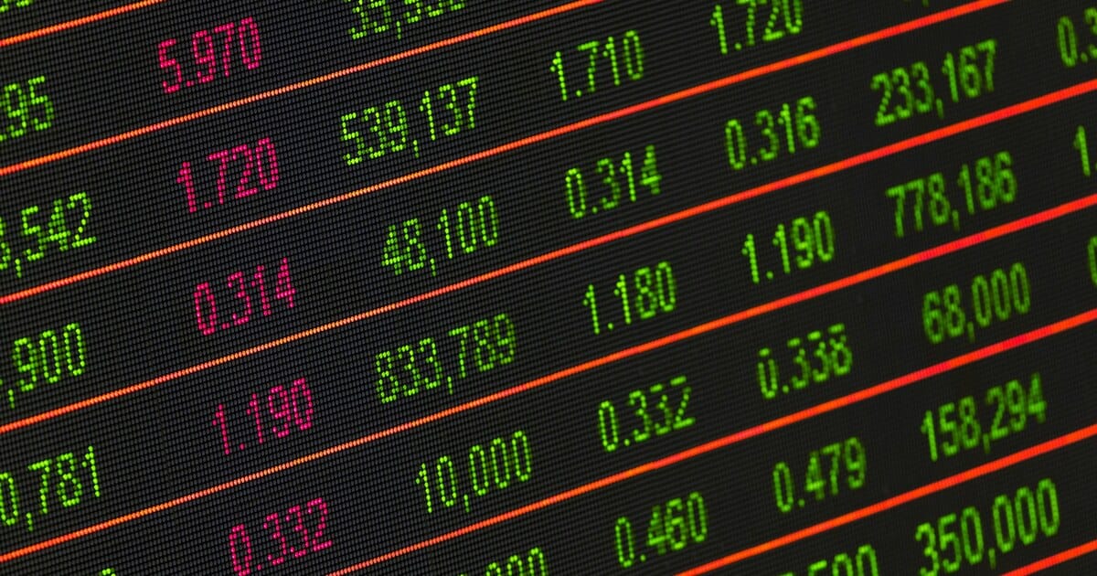 Stock exchange board showing live market data and ticker movement.